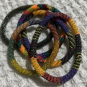 5 Sashka Co handcrafted beaded bracelets. Warm bright colors. Approx 8”.